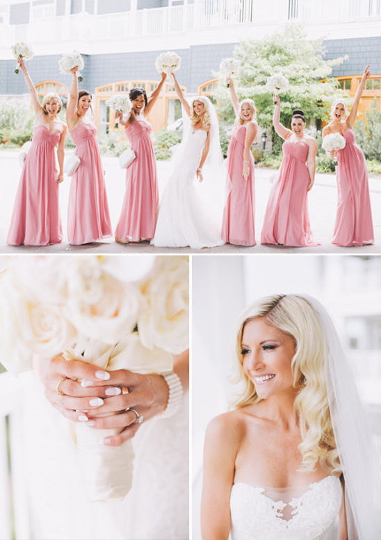 Happy bride with bridesmaids in pink dresses at a wedding