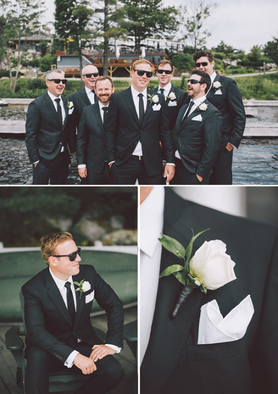 Groom and groomsmen wearing black suits and sunglasses, wedding day