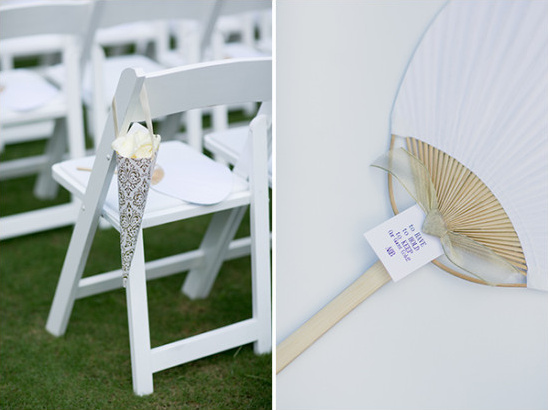 White wedding ceremony fans and flowers