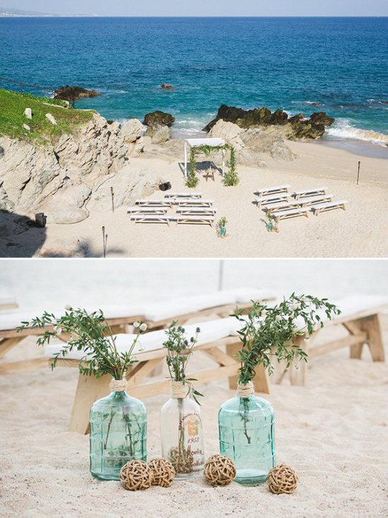 Beach wedding setup with ocean view and decorative vases
