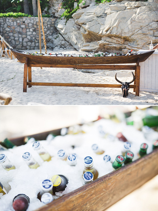 Beachside party beer cooler in a wooden boat with ice