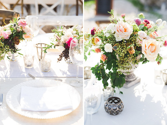 Elegant outdoor wedding table setting with floral arrangements