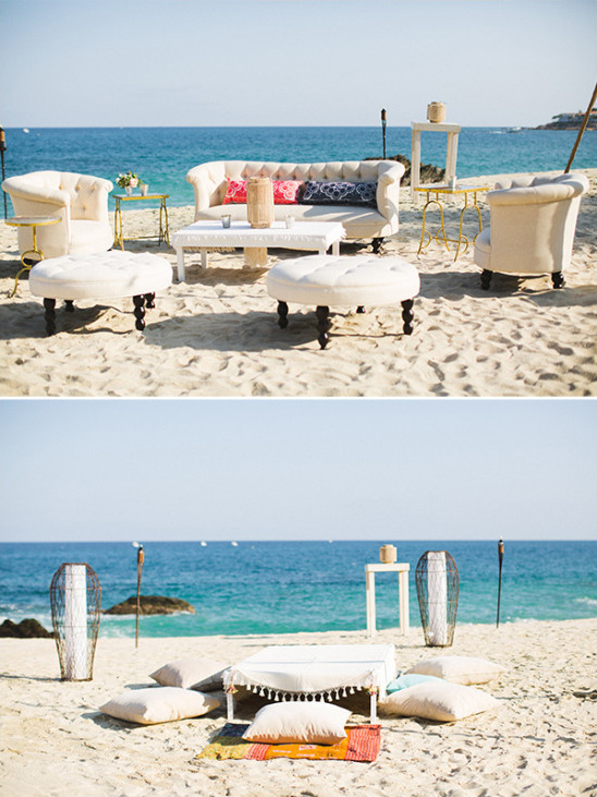 Beach lounge setup with furniture against a beautiful ocean backdrop
