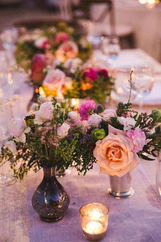 Romantic wedding table setting with floral centerpieces and candles