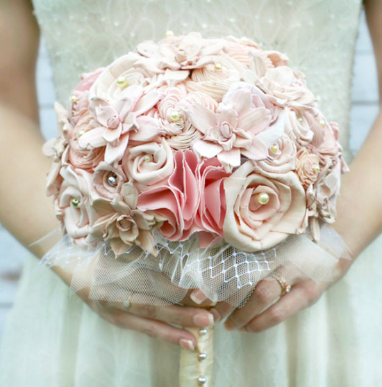 Elegant pink fabric flower bouquet for a bride on her wedding day