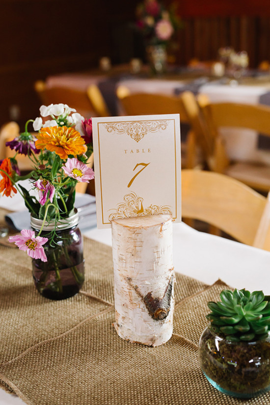 Wedding table setting with number seven and floral arrangement