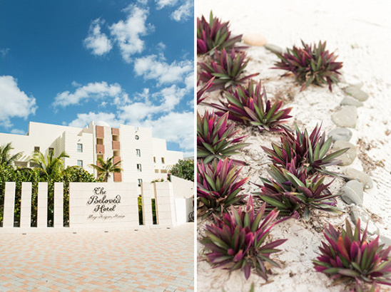 The Beloved Hotel entrance with beautiful landscaping and bright blue sky