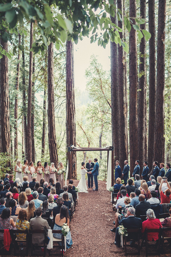 Wedding ceremony taking place in a serene forest setting