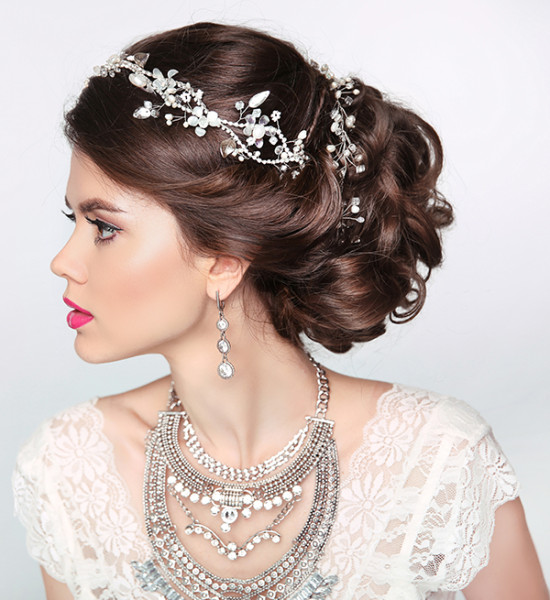 Elegant bride with a glamorous necklace and bridal hair style