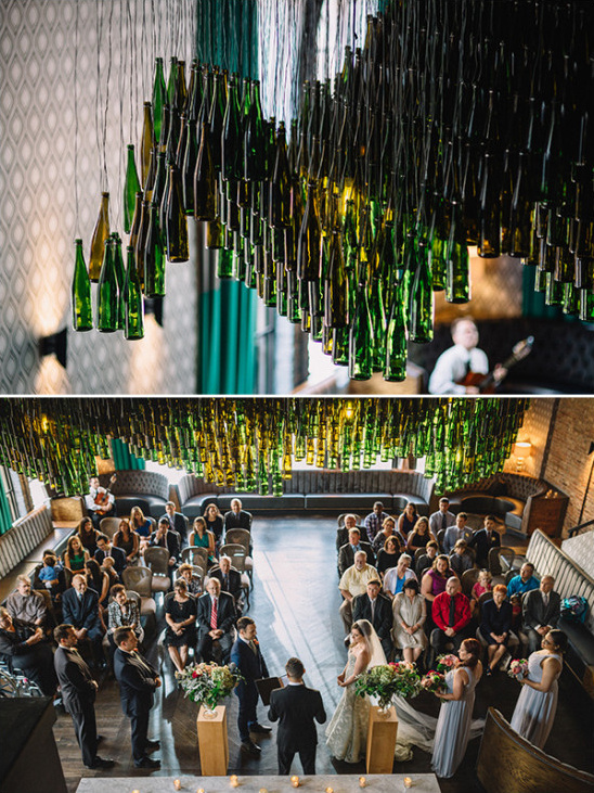 Wedding ceremony with unique decor of hanging glass bottles