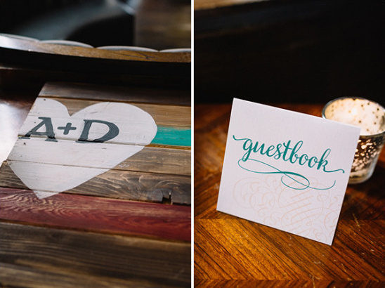 Rustic wedding decor with wooden heart and guestbook sign