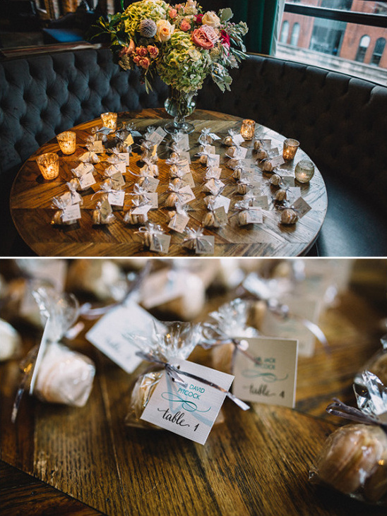 Wedding table with favors, flowers, candles and place cards ready
