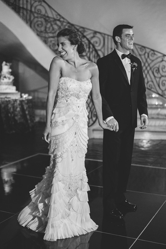 Happy bride and groom holding hands at their wedding ceremony