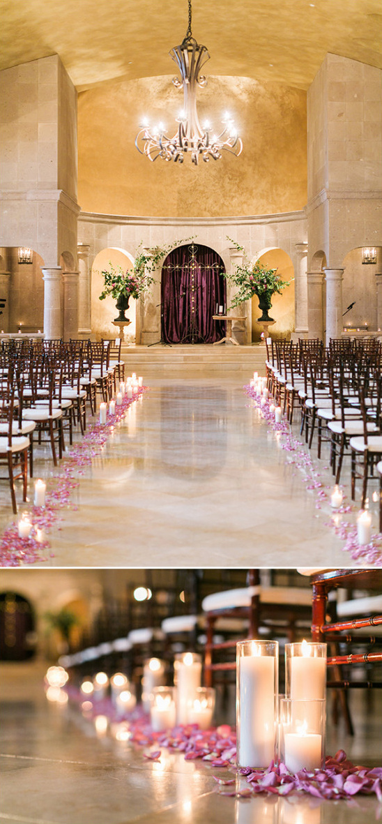 Elegant wedding ceremony with candlelit aisle and floral decor