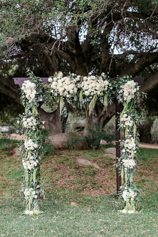 flower filled wedding arch