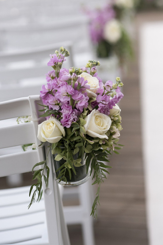 purple and white wedding ceremony flowers
