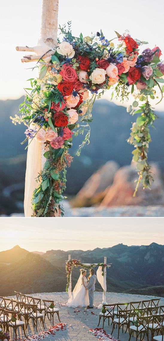 Wedding arch with colorful flowers on a mountaintop