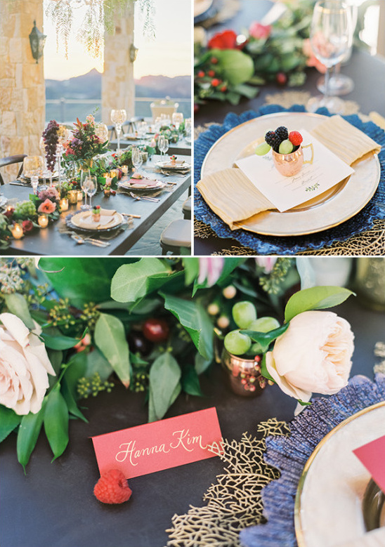 Elegant wedding table setting with flowers, fruit, and place cards