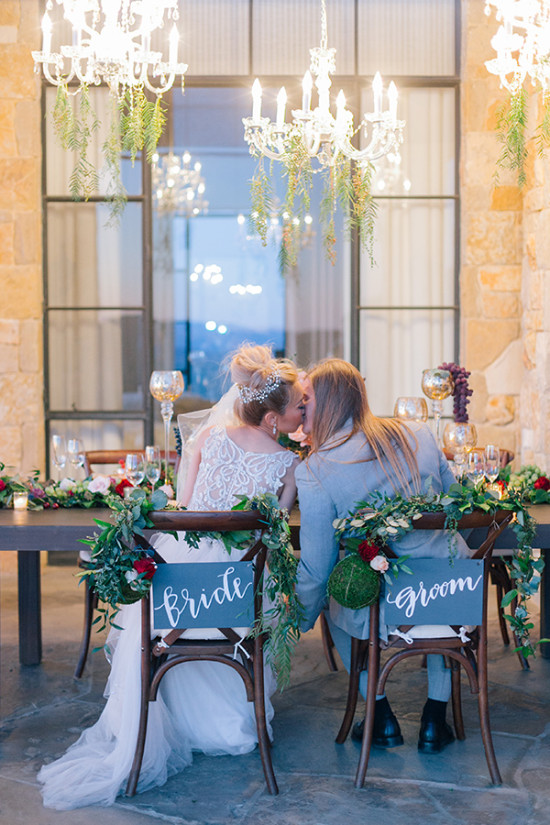 Bride and groom sharing a kiss at a wedding reception