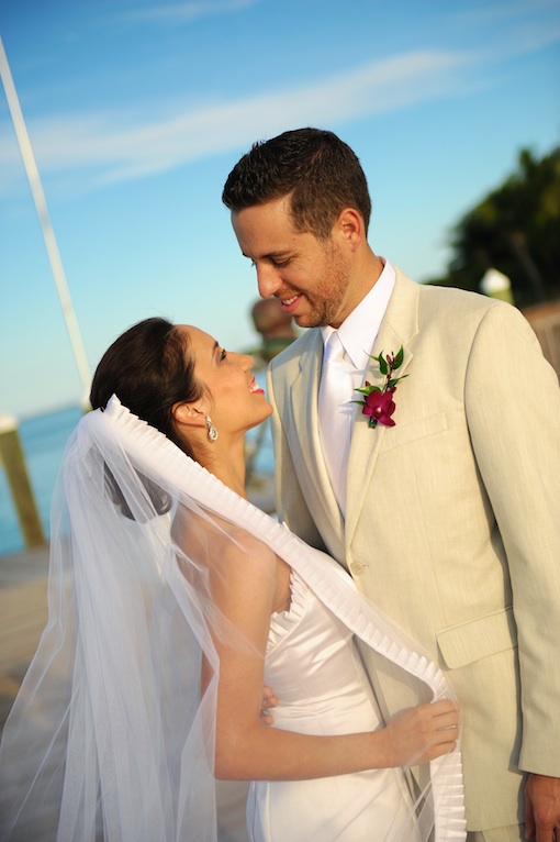 Happy newlyweds gaze at each other during their wedding