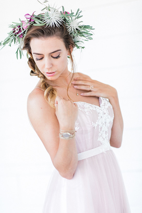 Bride with flower crown in a soft pink wedding dress