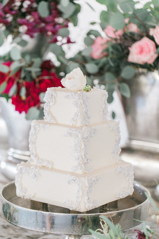 Elegant white three tier square wedding cake