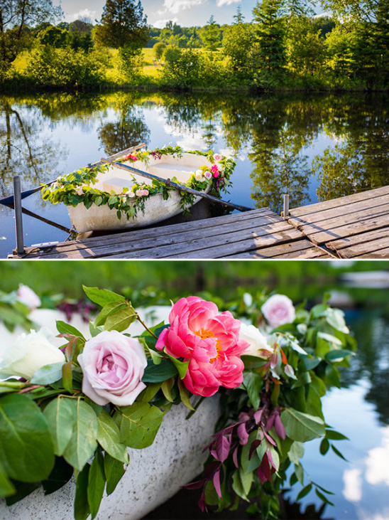 Floral decorated boat on a lake dock under sunny sky