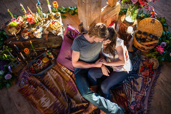 Romantic couple picnic with flowers candles and food