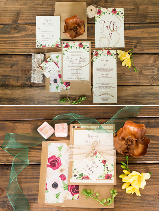 Elegant floral wedding invitation suite on wood table