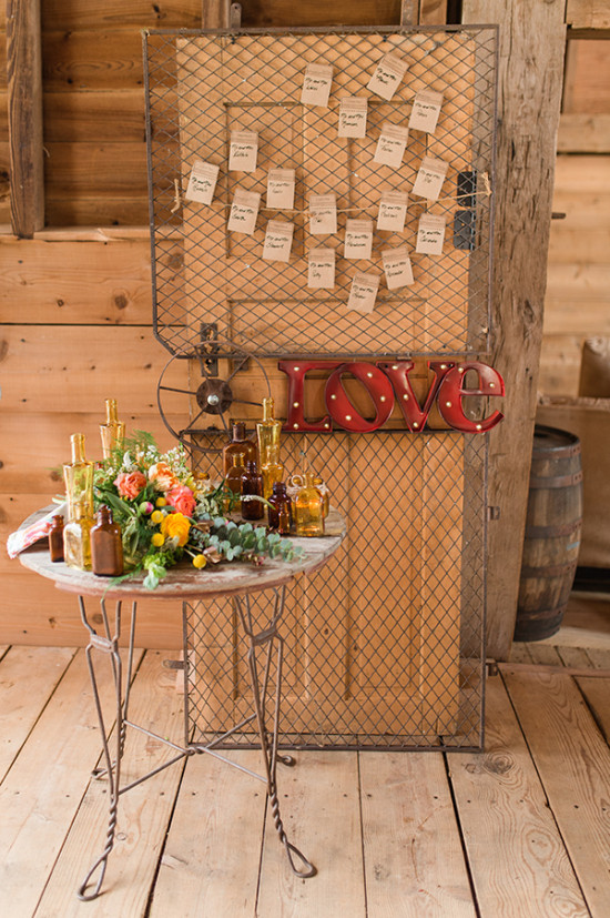 Rustic wedding decor with flowers love sign and seating chart