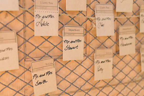 Rustic wedding seating chart with handwritten name cards