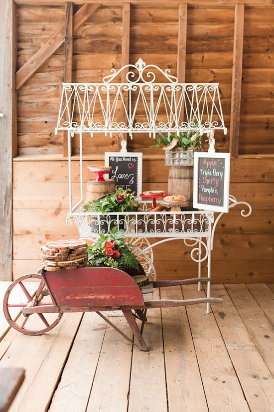 Rustic dessert cart with pies and vintage wheelbarrow