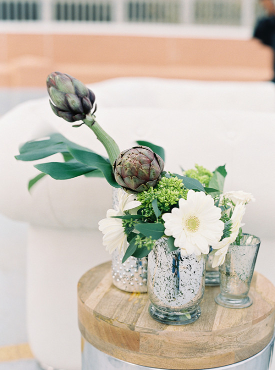 Artichoke floral display with white gerbera daisies