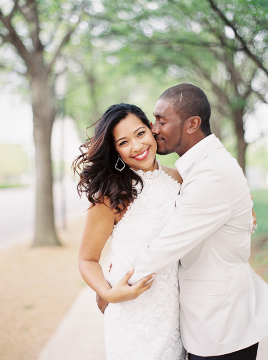 Happy couple embracing with green background