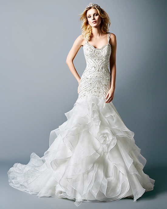 Bride wearing beaded strapless mermaid wedding gown