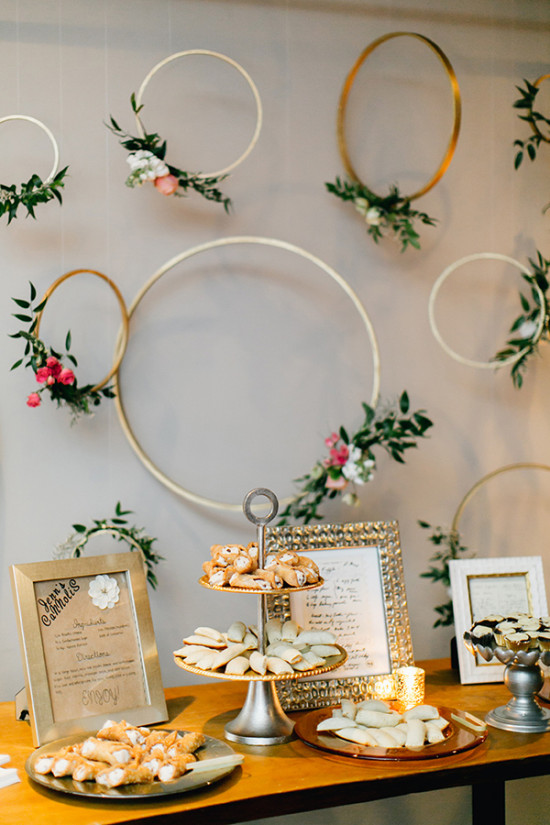 simple and beautiful gold embrodery hoop and flower dessert table backdrop