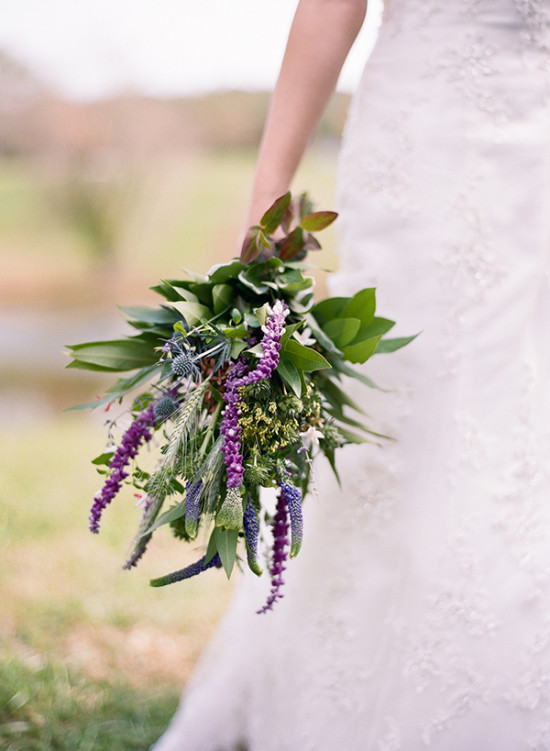 Bride with natural purple and green wedding bouquet