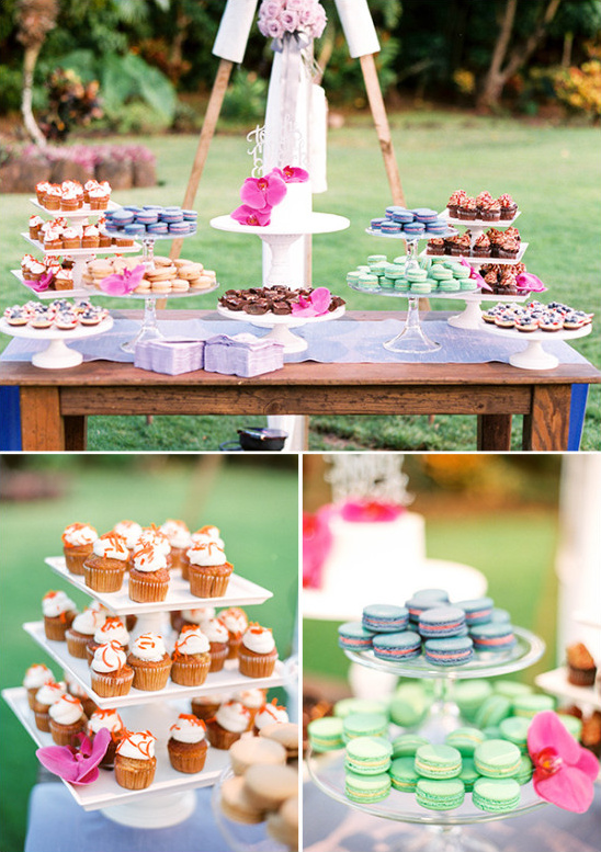 colorful dessert table with mini cupcakes macarons and a mini wedding cake