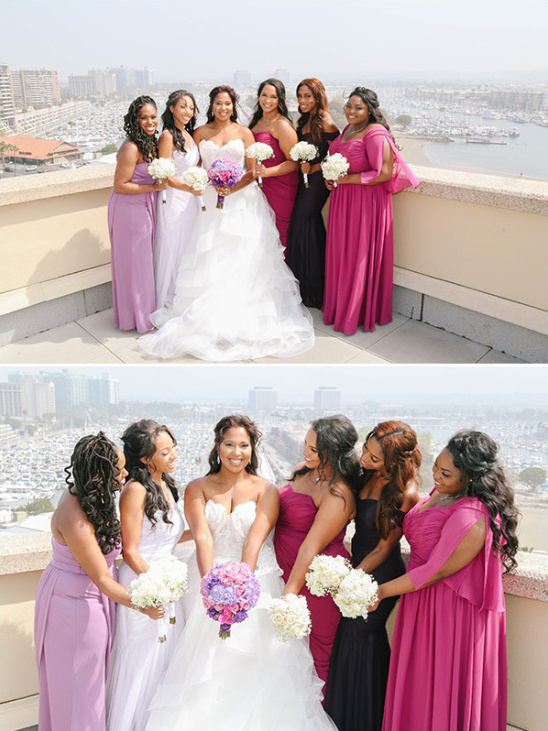 Bride with bridesmaids in purple and pink gowns