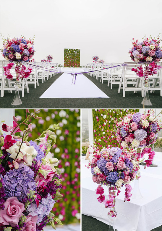 Wedding aisle with flower arrangements and white carpet