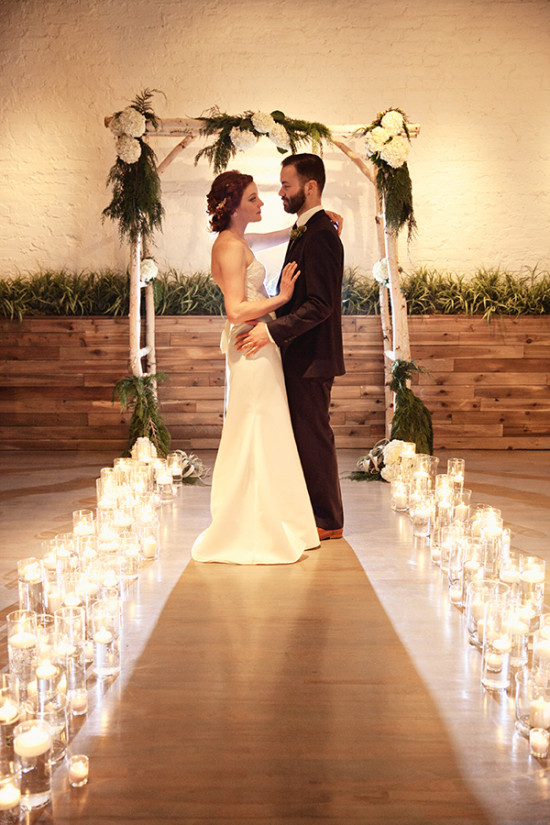 aspen and floral wedding arch with candles