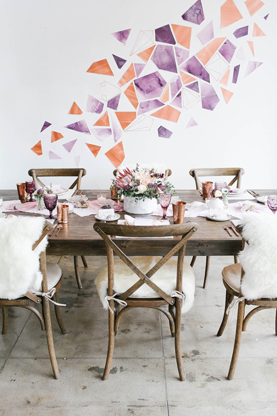 Elegant dining table with geometric wall art decor