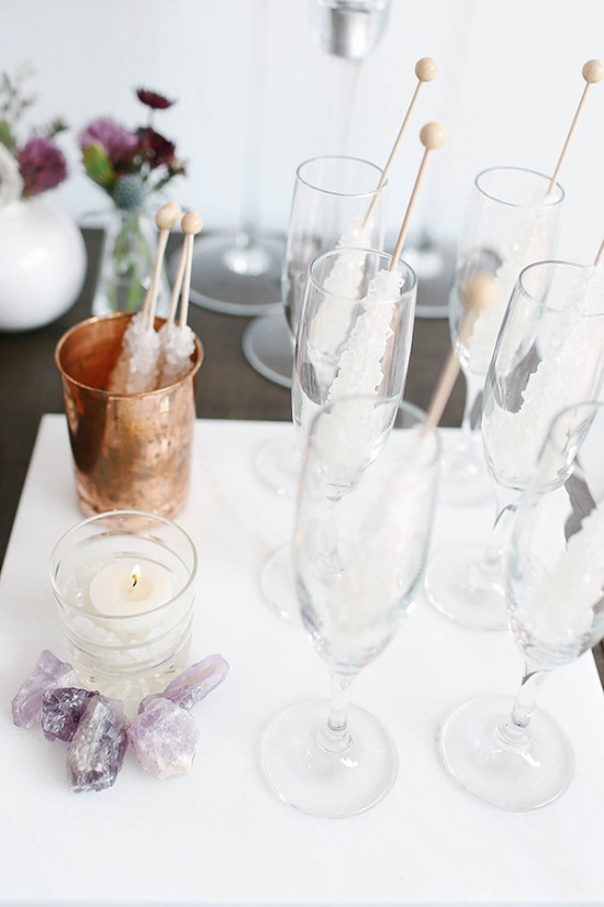 Celebration scene with champagne flutes and rock candy