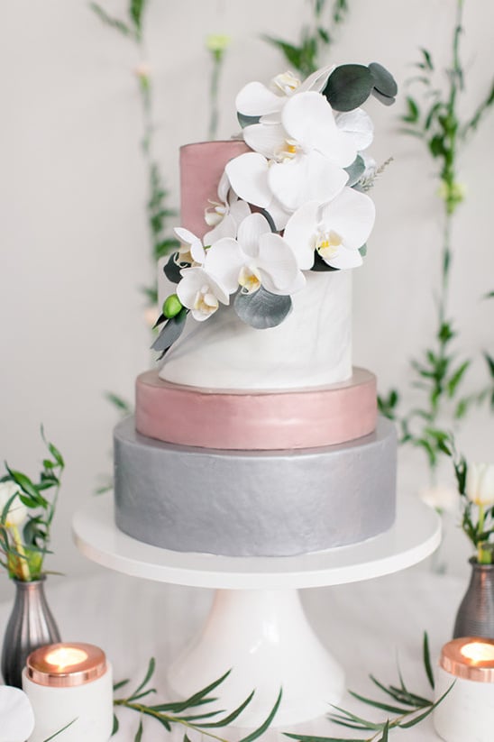 Pink white and grey cake with orchids