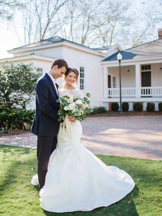 Bride and groom embracing after their outdoor wedding