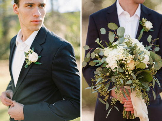 Groom in suit with boutonniere holding wedding bouquet