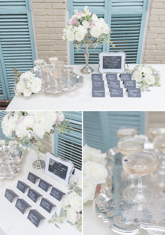 classy silver white and characoal gray welcome table with welcome cocktails
