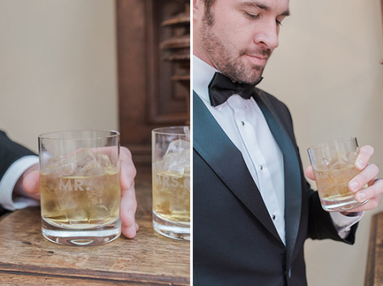 Groom in tuxedo with Mr and Mrs whiskey glasses