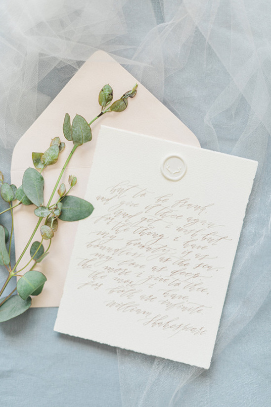 elegant calligraphy wedding invitation with wax seal