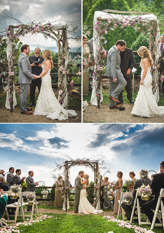 Outdoor wedding ceremony with floral arch and mountain views